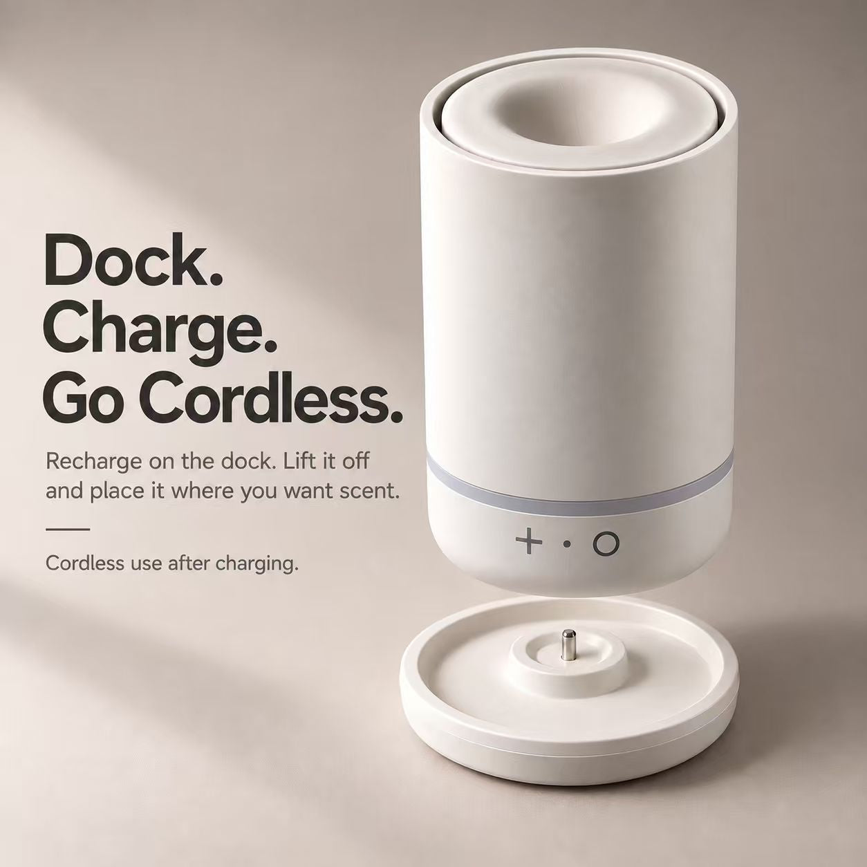 Ivory diffuser lifted above its matching charging dock
